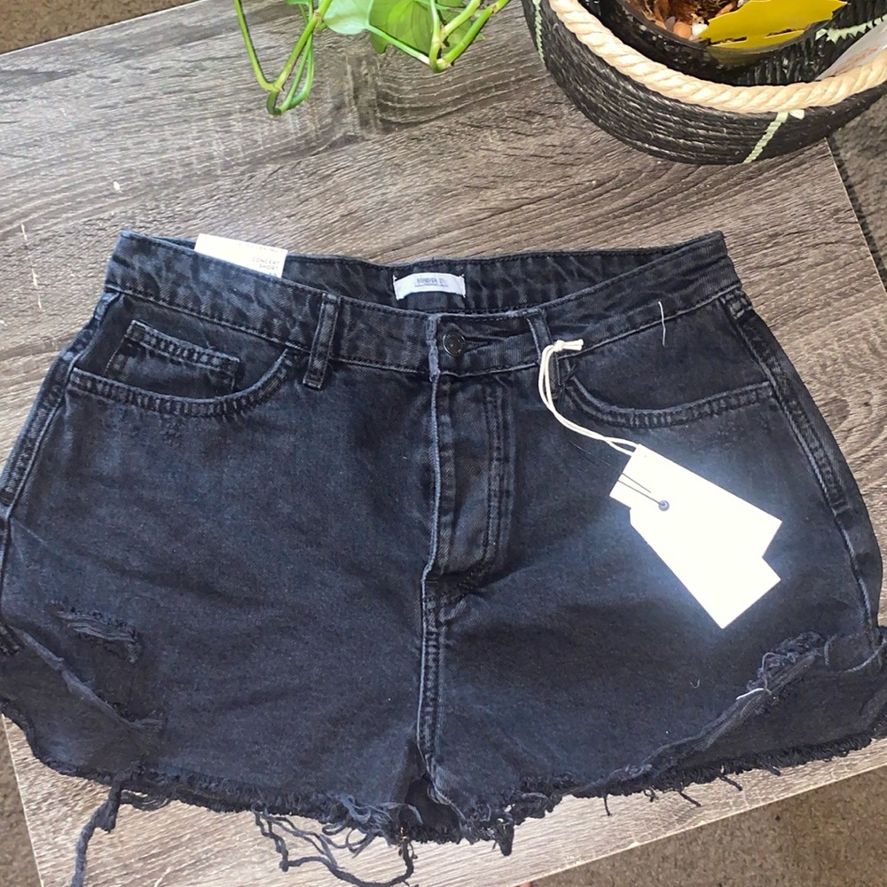 Mid rise slim fit jean shorts.